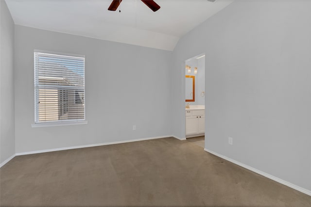 unfurnished room featuring light carpet, vaulted ceiling, and ceiling fan