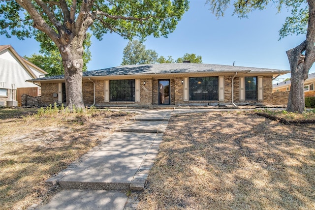 ranch-style house with cooling unit