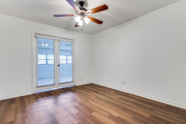 empty room with hardwood / wood-style floors and ceiling fan