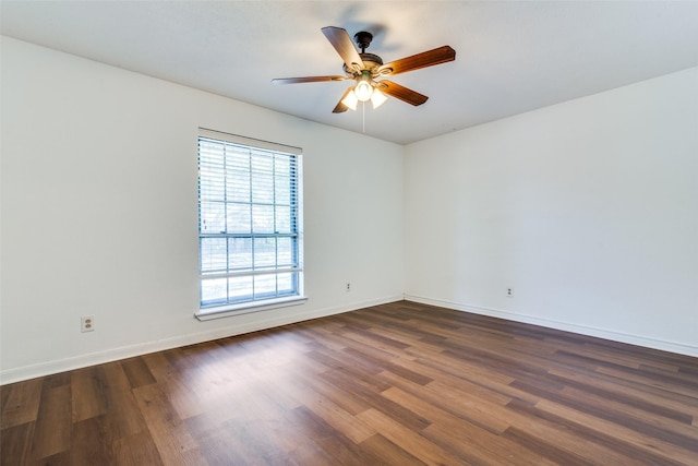 unfurnished room featuring dark hardwood / wood-style floors and ceiling fan