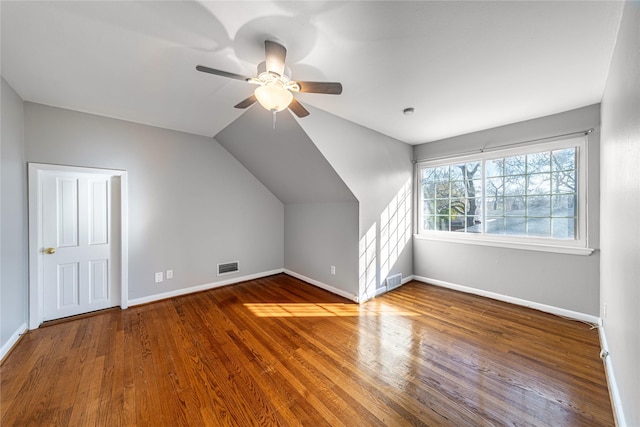 bonus room with ceiling fan, wood-type flooring, and lofted ceiling