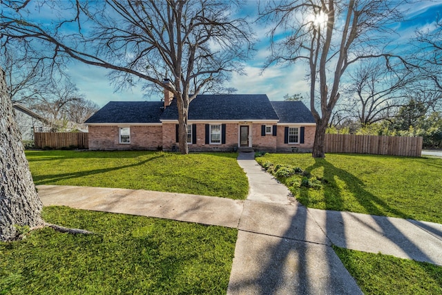 ranch-style house with a front lawn