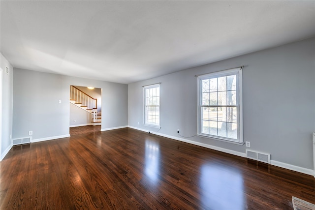 unfurnished room with dark hardwood / wood-style floors