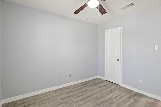 spare room featuring ceiling fan and light hardwood / wood-style floors