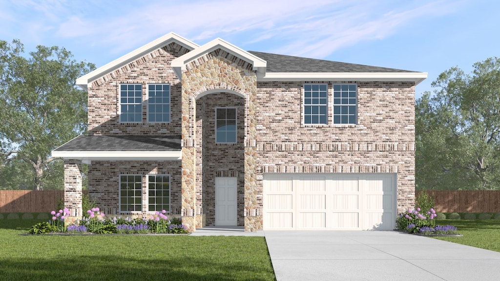 view of front property featuring a front lawn and a garage