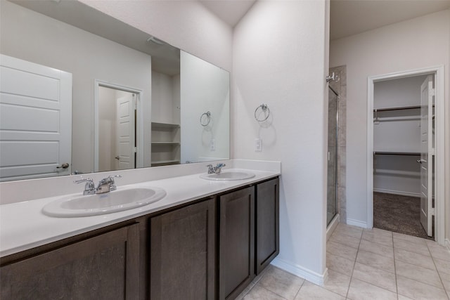 bathroom with vanity, tile patterned flooring, and a shower with shower door