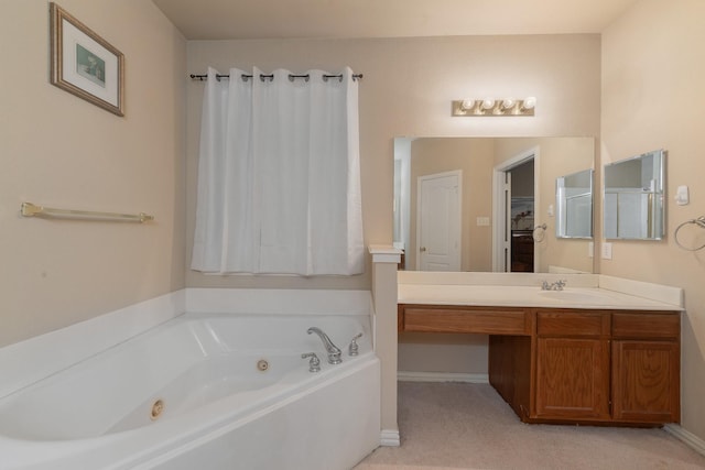 bathroom featuring a tub to relax in and vanity