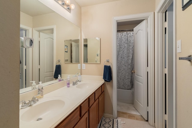 bathroom featuring walk in shower, vanity, and tile patterned floors