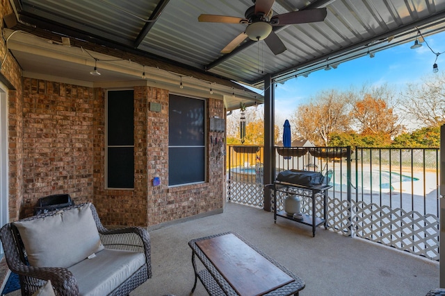 view of patio / terrace featuring ceiling fan, a fenced in pool, and area for grilling