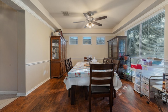 dining area with ceiling fan and dark hardwood / wood-style flooring