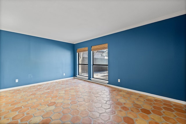 spare room with crown molding