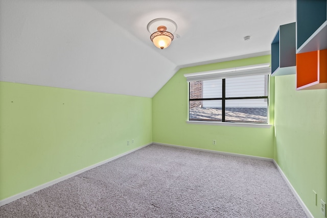 bonus room featuring lofted ceiling and carpet floors