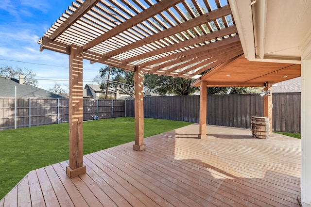 wooden terrace featuring a yard and a pergola