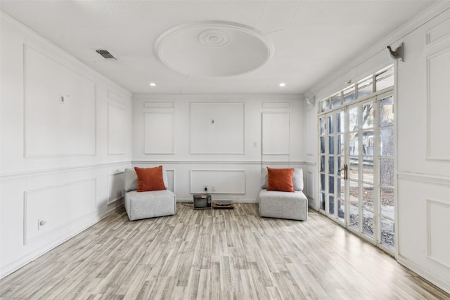 living area with light hardwood / wood-style floors