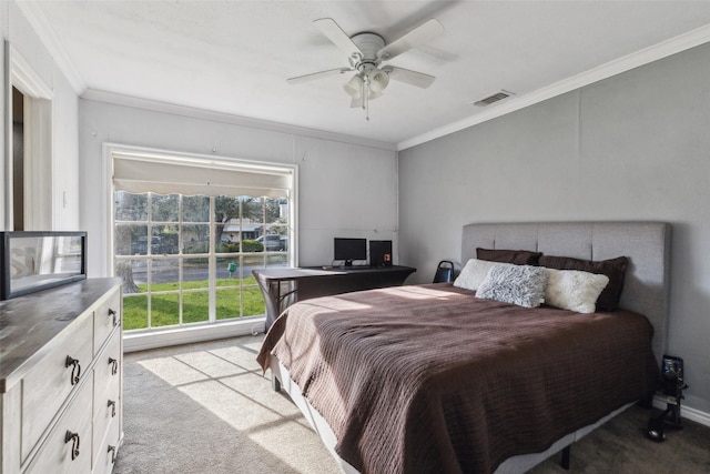 carpeted bedroom featuring ceiling fan, multiple windows, and crown molding