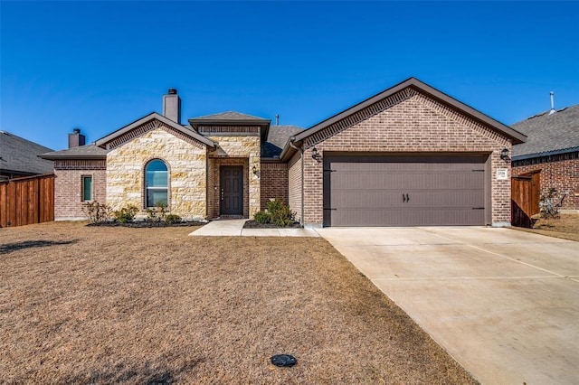 ranch-style house featuring a garage