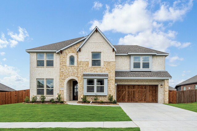 1233 Sylvia St, Desoto, TX 75115 - view of front of home featuring a garage, concrete driveway, a front lawn, and a shingled roof