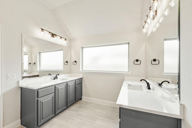 1233 Sylvia St, Desoto, TX 75115 - full bath featuring double vanity, vaulted ceiling, and baseboards