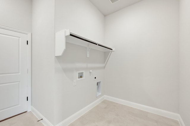 1233 Sylvia St, Desoto, TX 75115 - laundry room featuring gas dryer hookup, electric dryer hookup, washer hookup, and baseboards