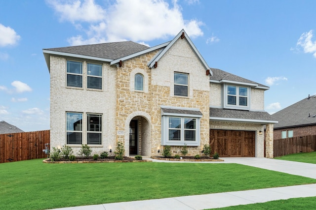 1233 Sylvia St, Desoto, TX 75115 - view of front facade featuring driveway, stone siding, an attached garage, and a shingled roof