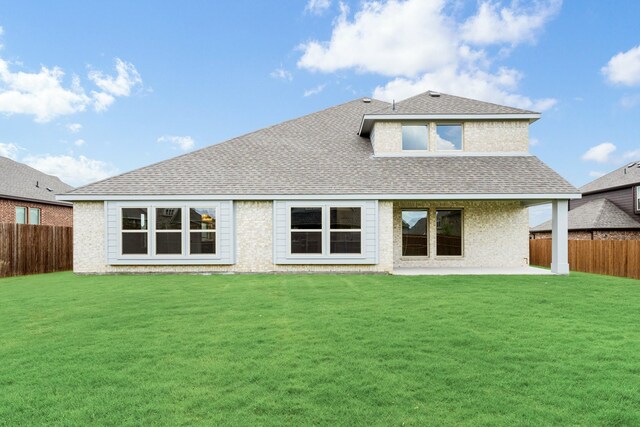 1233 Sylvia St, Desoto, TX 75115 - back of house with a shingled roof and a patio