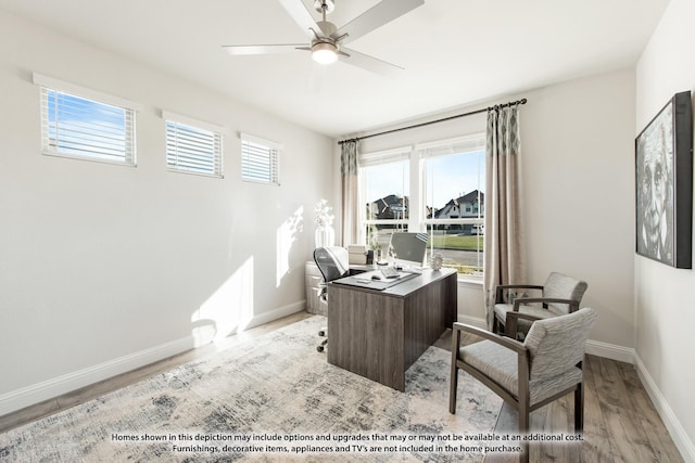 office area with light hardwood / wood-style floors and ceiling fan