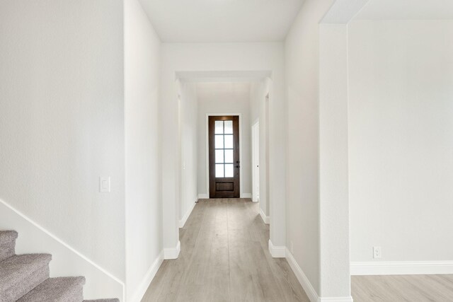 1233 Sylvia St, Desoto, TX 75115 - corridor with light wood-style floors, baseboards, and stairway