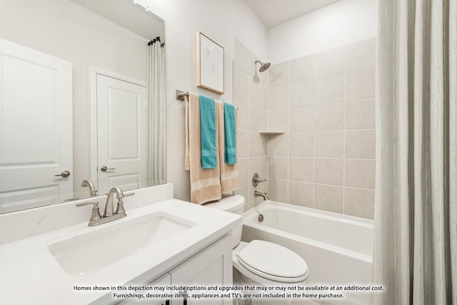 full bathroom featuring toilet, tiled shower / bath combo, and vanity