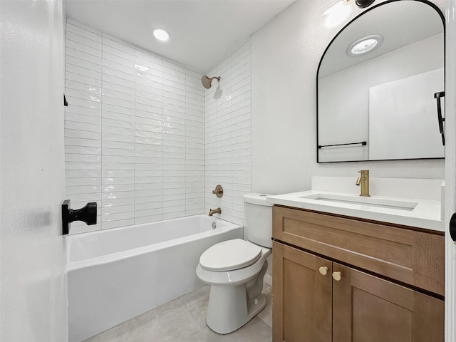 bathroom featuring vanity, tile patterned floors, toilet, and tub / shower combination