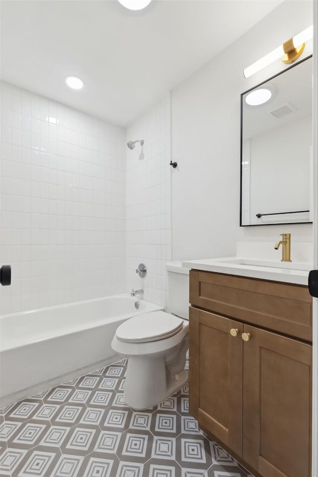 bathroom featuring tile patterned floors, visible vents, toilet, shower / bathtub combination, and vanity