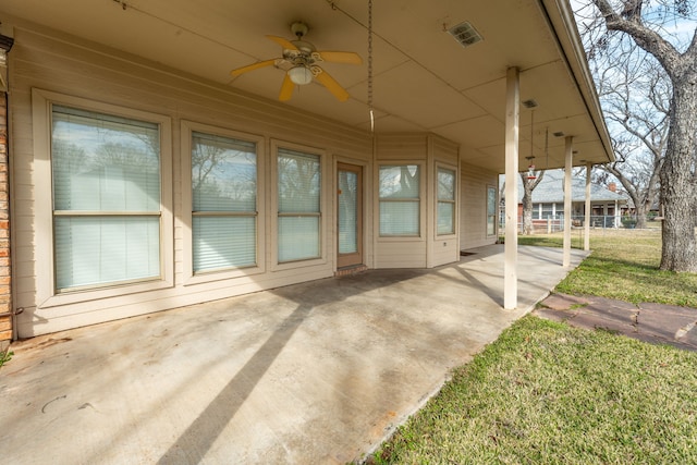 view of patio featuring ceiling fan