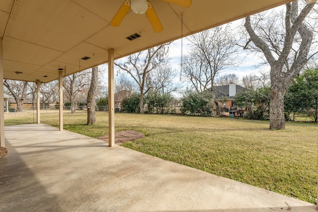 exterior space with ceiling fan and a patio area