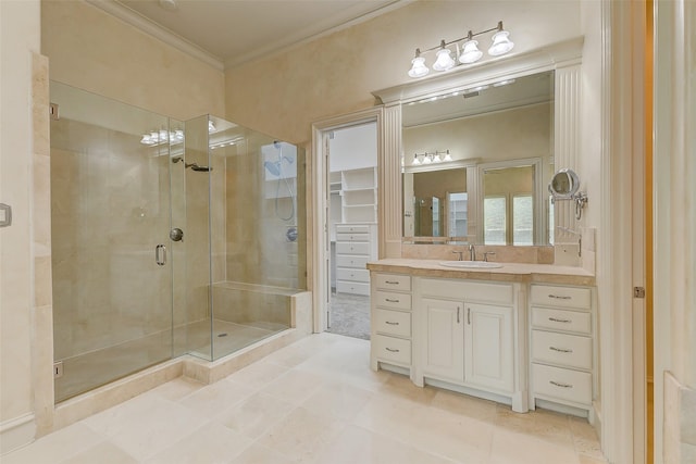 bathroom with crown molding, tile patterned floors, vanity, and walk in shower