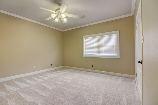 carpeted empty room featuring crown molding and ceiling fan