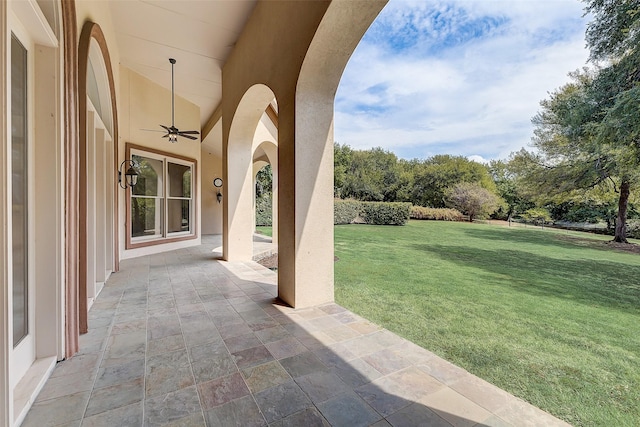 view of patio featuring ceiling fan