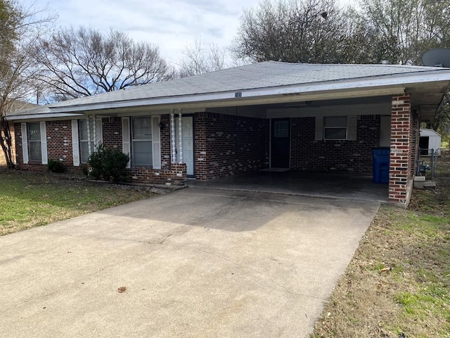 ranch-style house featuring a carport