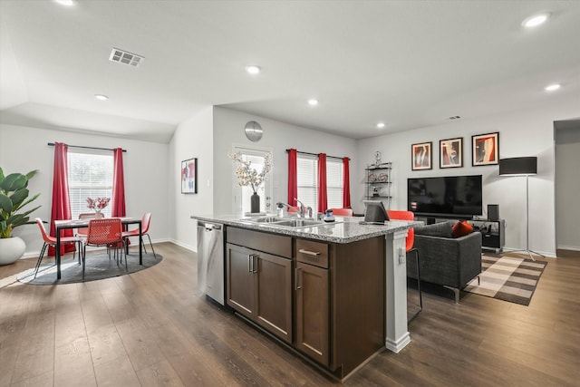 kitchen with stainless steel dishwasher, a kitchen island with sink, dark hardwood / wood-style flooring, and sink