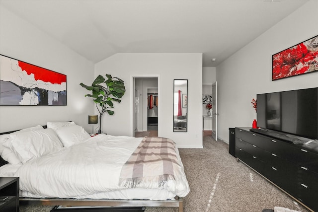 bedroom featuring vaulted ceiling and carpet