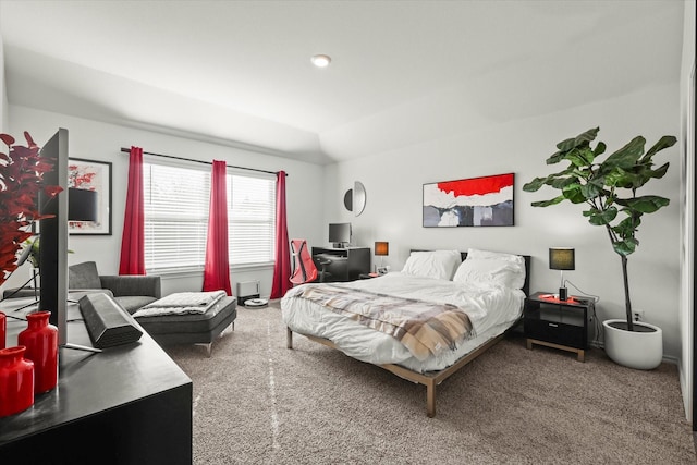 carpeted bedroom featuring vaulted ceiling