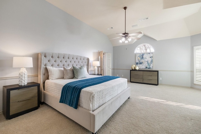 bedroom featuring light carpet, ceiling fan, lofted ceiling, and multiple windows