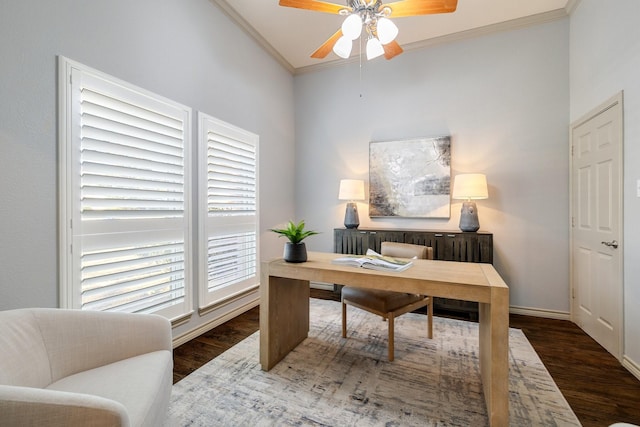 office area with vaulted ceiling, dark wood-type flooring, ornamental molding, and ceiling fan