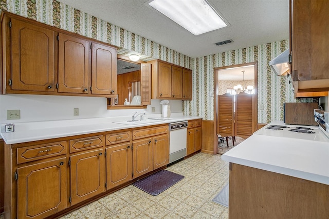 kitchen featuring a notable chandelier, white dishwasher, a textured ceiling, range hood, and sink