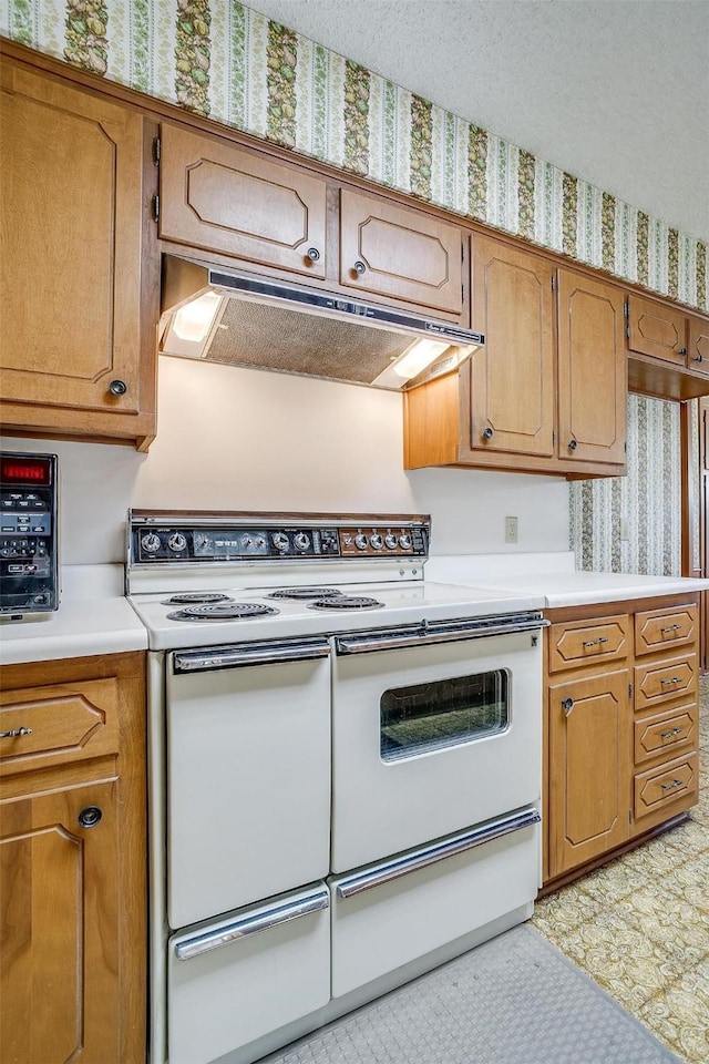 kitchen featuring range with two ovens