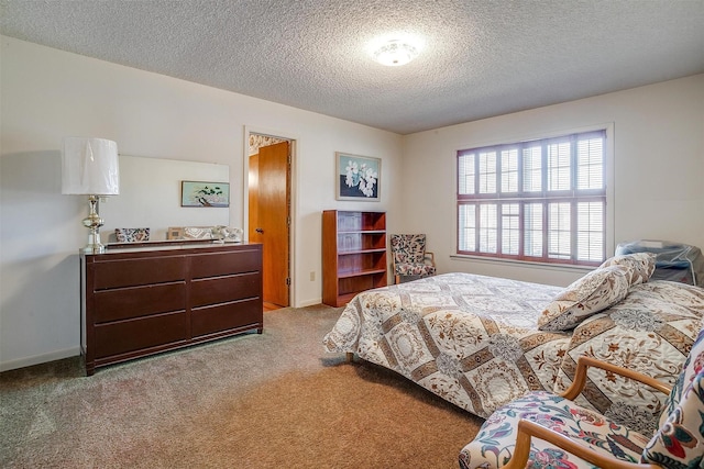 carpeted bedroom featuring a textured ceiling