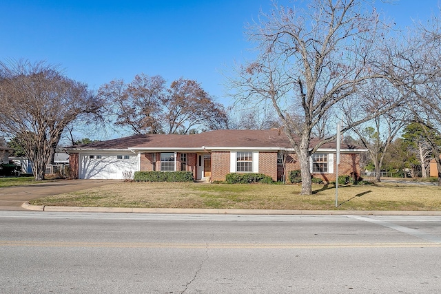 ranch-style house with a front lawn and a garage