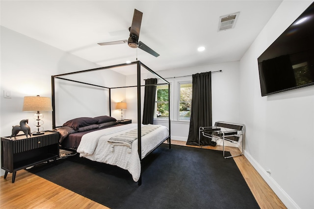 bedroom featuring ceiling fan and hardwood / wood-style flooring