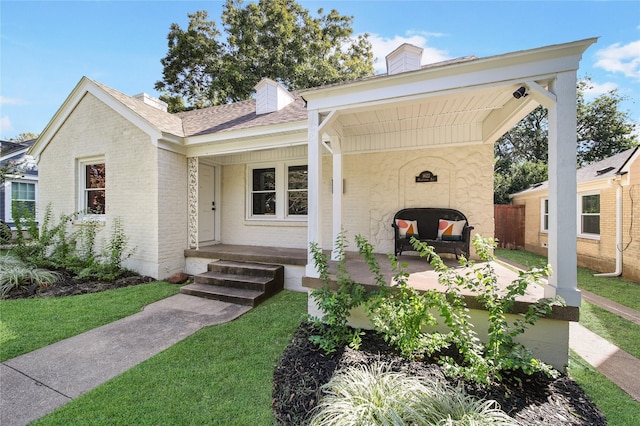 view of front facade with a porch and a front yard