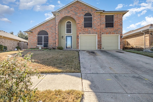 front of property featuring a front lawn and a garage