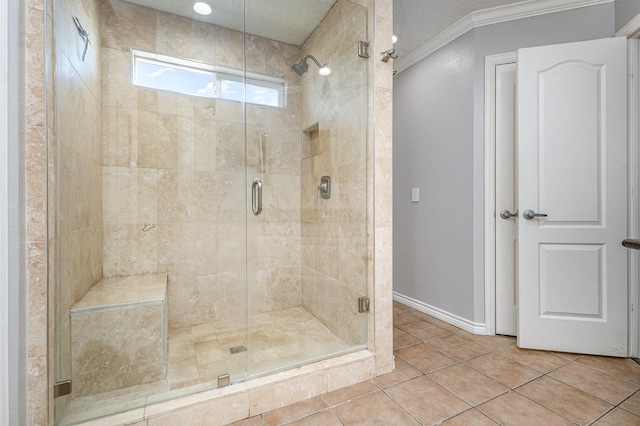 bathroom featuring ornamental molding, tile patterned floors, and an enclosed shower