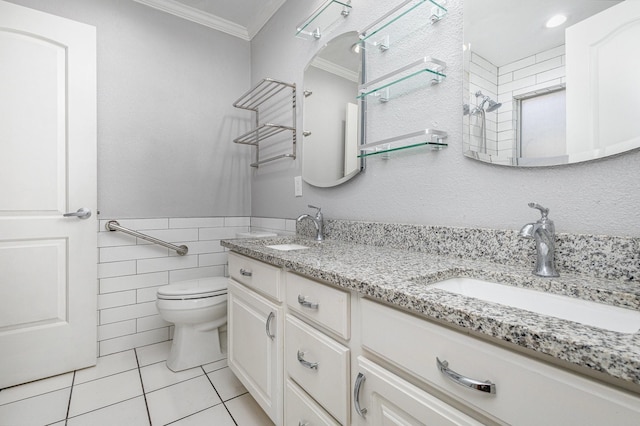 bathroom featuring tile patterned flooring, vanity, tile walls, toilet, and crown molding